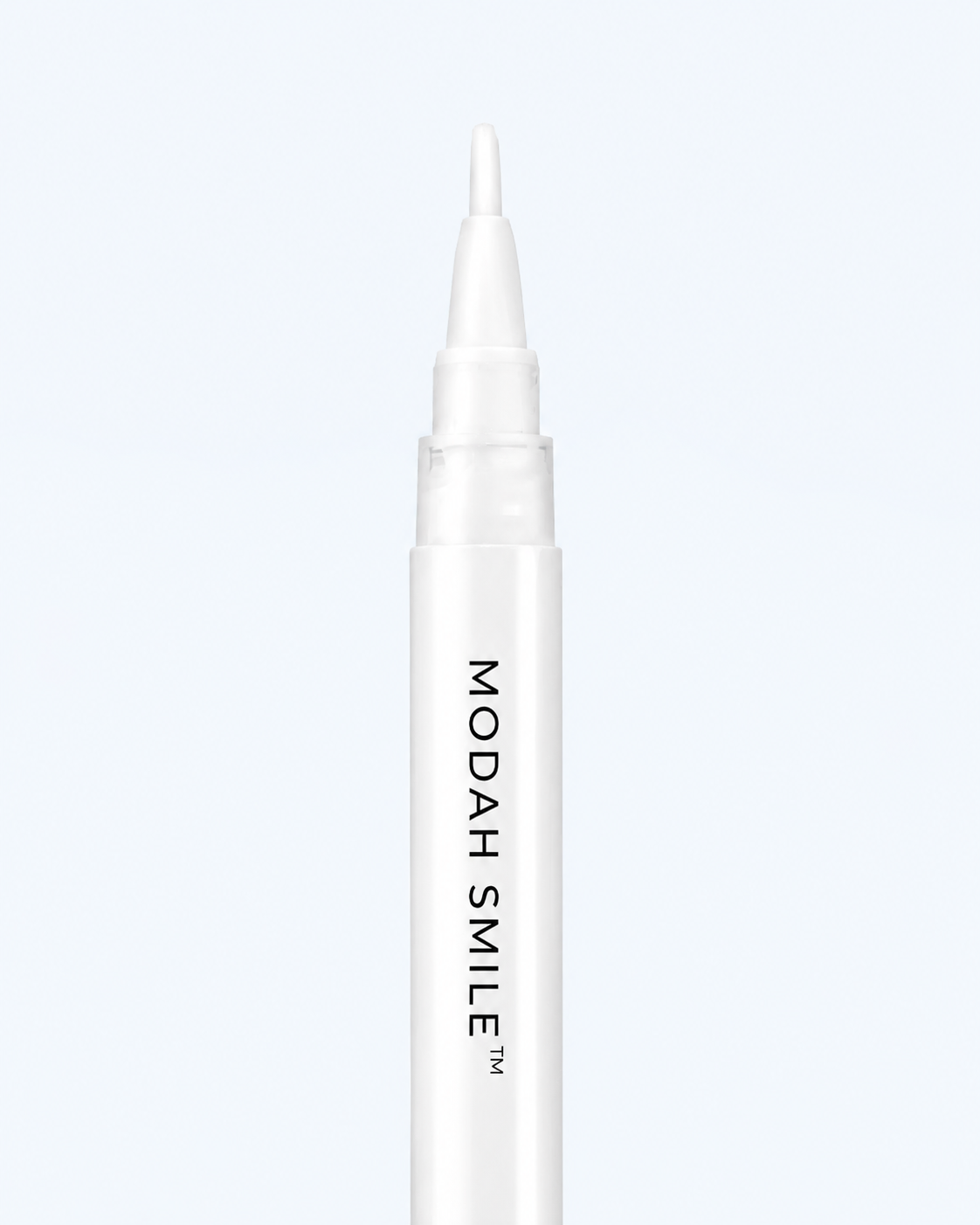 A white cosmetic pen-style applicator with the text 'MODAH SMILE TM' printed vertically in black, shown against a very light gray background.