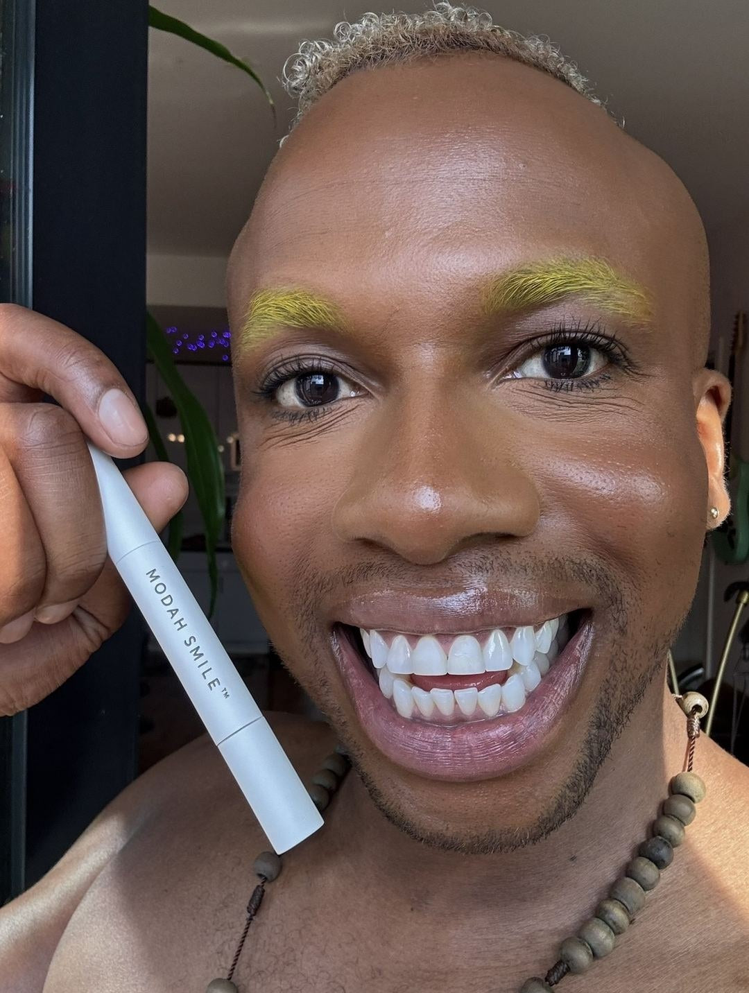 Dean holding the MODAHSMILE Whitening Pen